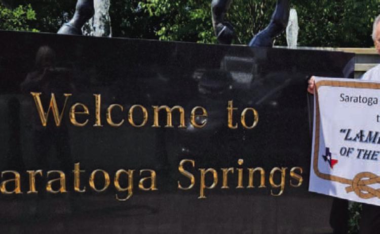 Former Lampasan Phil King is pictured on a recent visit to Saratoga Springs, New York, where he displayed his banner proclaiming it the “Lampasas of the North.” COURTESY PHOTO