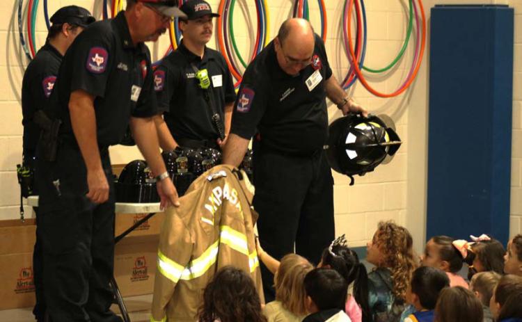 Lampasas firemen talk to Hanna Springs Elementary School students concerning fire safety in and around the home and what to do if a fire breaks out. JOYCESARAH MCCABE | DISPATCH RECORD