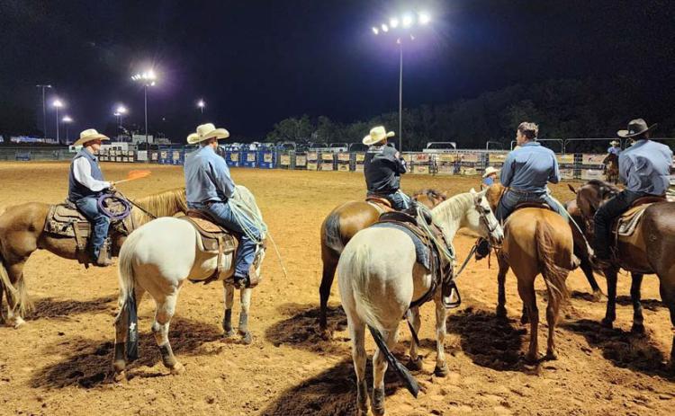 At far left is CPRA judge Bill Herbert, a former four-time CPRA saddle bronc champion. He awaits with entrants for the start of the team roping event at the 2023 Riata Roundup Rodeo held at the 580 West Sports Complex in Lampasas. file photo