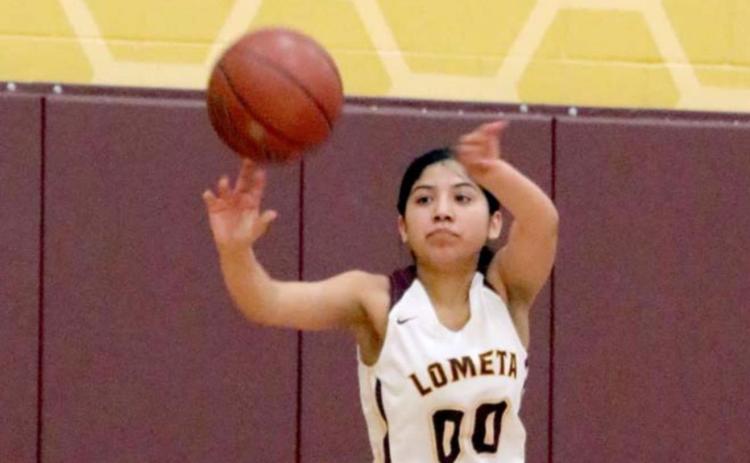 Emily Andrade passes the ball in a 38-37 Lometa victory on Friday. JESSICA MALDONADO | LOMETA ISD