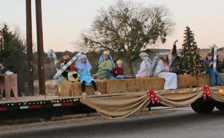 Members of Lometa’s First Baptist Church provide a depiction of Jesus’ birth, set on a hayride for the parade. Mason Hines | dispatch record