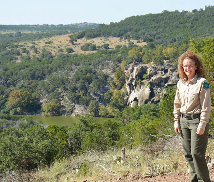 Kasey Sloan, park superintendent at Post Oak Ridge, stands at a vantage point that overlooks the Colorado River which forms the western edge of the new state park that straddles the Lampasas-Burnet County line northwest of Naruna. Day passes can be booked online for entrance to the property. COURTESY PHOTO | JEFF LOWE