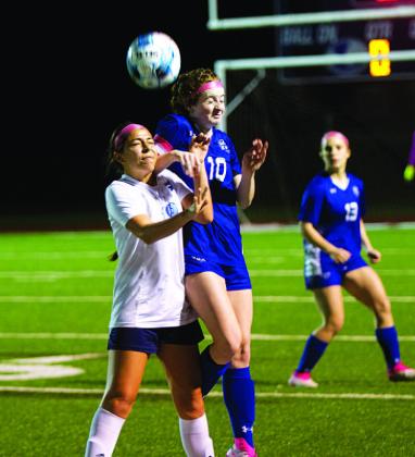 HUNTER KING | DISPATCH RECORD Kelbie Black battles for a header during the first half of last Friday’s match.