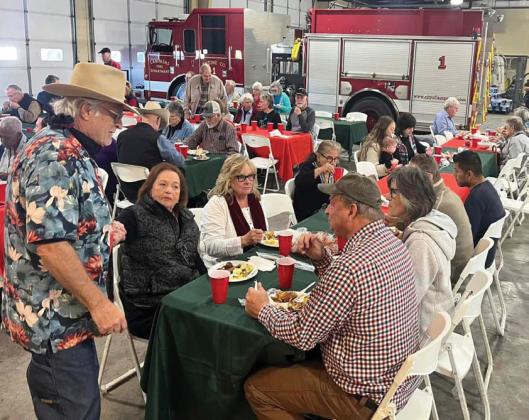 Attendees enjoy their food during the annual holiday luncheon sponsored by the Lampasas Police Department and fire department. Approximately $4,700 was raised at the luncheon to help provide toys to 300-350 children in the community. courtesy photo | Lampasas Fire Department