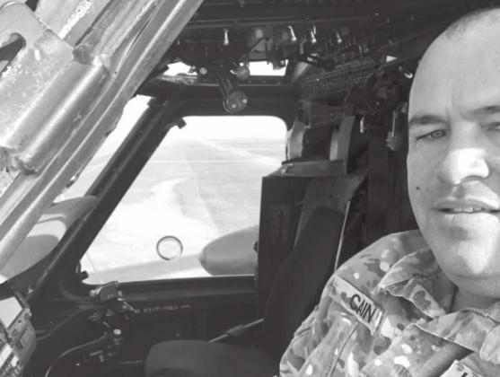 Chief Warrant Officer 2 Allen Cain sits inside a Blackhawk helicopter on deployment to Saudia Arabia. COURTESY PHOTO