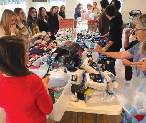 Students help assemble gift bags for distribution across Lampasas County. courtesy photo