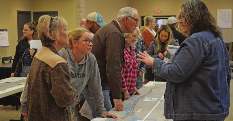 Tamara Hamm, at left, and Debra Shutts speak with TxDOT officials concerning the proposed U.S. Highway 281 Lampasas-to-Evant expansion project. ERICK MITCHELL | DISPATCH RECORD