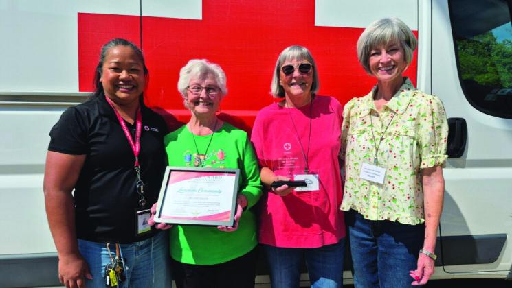 American Red Cross presented an award to Lampasas for its successful blood drive donations. Pictured are, from left to right, Robeap Santos of the American Red Cross; Wanda Lang, blood program leader for Lampasas; and Sharon Hague and Tracey Aaron, local blood drive volunteers. COURTESY PHOTO