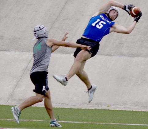 Case Brister hauls in a touchdown pass from Dax Brookreson in 7-on-7 action Monday. Lampasas beat Burnet in the game pictured above and Georgetown East View in the finale. JEFF LOWE | DISPATCH RECORD