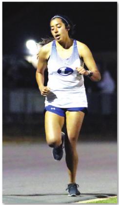 Leilany Alvarez jogs down the track during her long-distance run last Thursday in Llano. BRILEY MITCHELL | COURTESY PHOTO