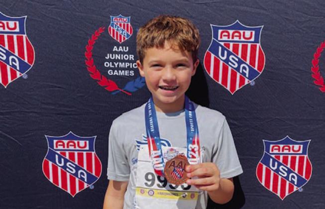 Vion Miller poses with his medal from the AAU Junior Olympics. COURTESY PHOTO