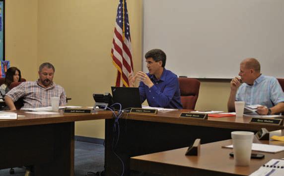 At center, Superintendent Dr. Chane Rascoe discusses LISD’s staff study with trustees during the March 4 school board meeting. Also pictured are board member Jeff Rutland, at left, and board president Randy Morris. ERICK MITCHELL | DISPATCH RECORD
