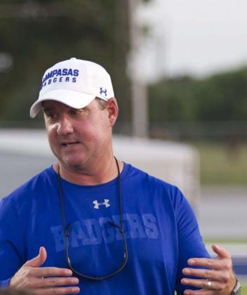 Head Coach Troy Rogers speak to his team last week after the Badgers’ second scrimmage, which was against Navasota. Rogers is a former Badger quarterback and is in his sixth year in charge of the Lampasas program. HUNTER KING | DISPATCH RECORD