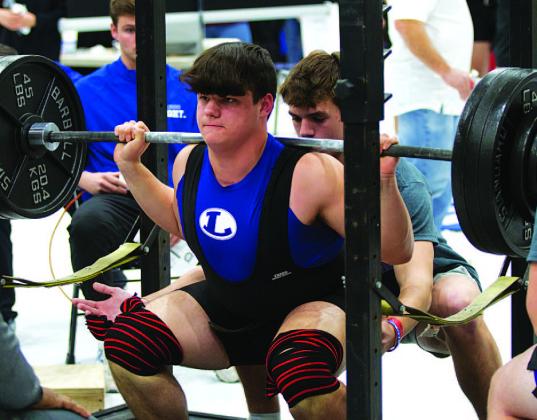 Bodhi Westra lifts during the squat portion of the Badgers’ home powerlifting meet last week. HUNTER KING | DISPATCH RECORD