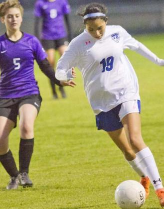 Koral Amador brings the ball downfield in a district match at Florence on Monday. JEFF LOWE | DISPATCH RECORD