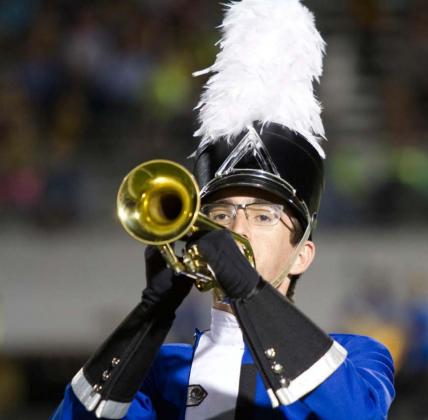 Senior Travis Calk is among the upperclassmen in the Badger Band. He is shown here playing the trumpet during a halftime performance of “The Witching Hour.” hunter king | Dispatch Record