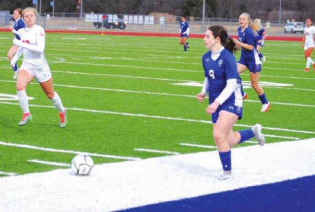 Bella Lindsey dribbles down the left wing against the Lake Belton Lady Broncos. HUNTER KING | DISPATCH RECORD