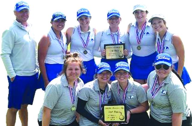 COURTESY PHOTO | JUSTIN SCHULZE The two Lady Badger golf teams pose with their district champion and district runner-up trophies after their success this week.