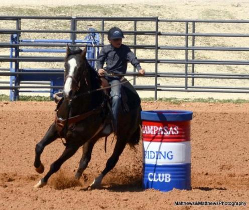 Lucky Bumpas, 8, rides his horse around a barrel during a junior rodeo event in March. COURTESY PHOTO