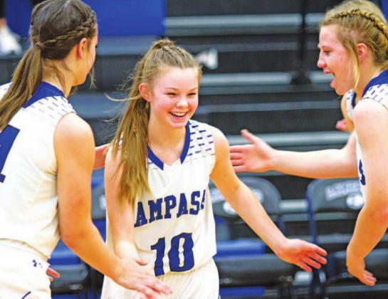 Addison Borchard high-fives Rebekah Pearce and Aspen Wheeler before a contest early in the season. The freshman is the primary ball handler for the Lady Badgers. HUNTER KING | DISPATCH RECORD