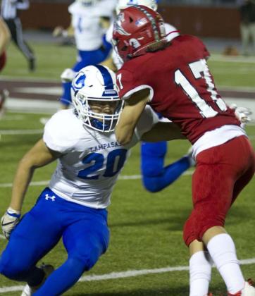 Levi Rivera wraps up a Fredericksburg receiver during the Badgers’ 52-42 win last week. HUNTER KING | DISPATCH RECORD