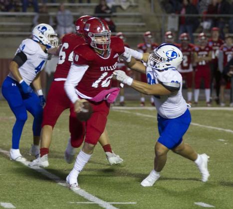 Josh Carter puts pressure on Fredericksburg quarterback Cole Immel, which he did most of the night, with nine total pressures in the game. HUNTER KING | DISPATCH RECORD