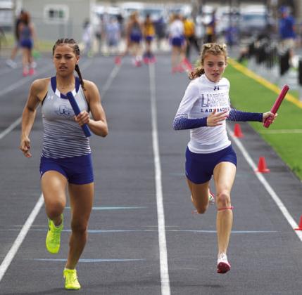 Hailey Palmer, at right, runs the final leg of the 4x100-meter relay at the area track meet. HUNTER KING | DISPATCH RECORD