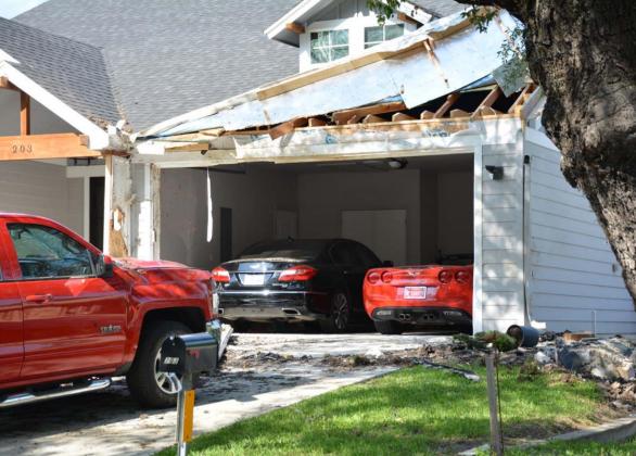 Damage was visible at 203 S. Howe St. over the weekend after a vehicle crashed into the house Saturday about 1:30 a.m. DAVID LOWE | DISPATCH RECORD