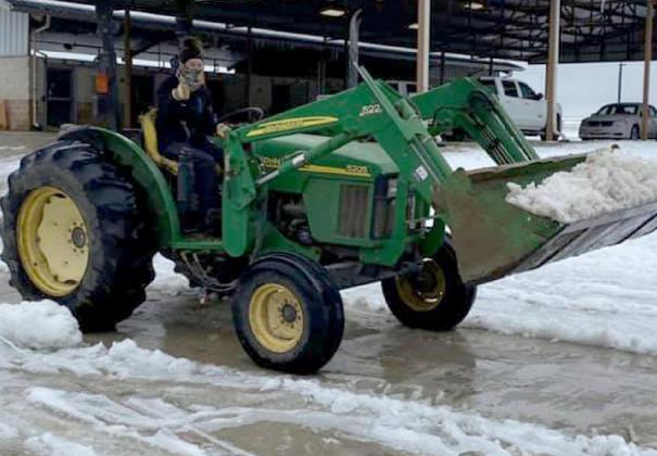 Meagan Cline plows snow last winter during a week of extra duty at her job in Bryan. COURTESY PHOTO