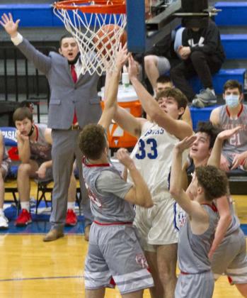 Carter Johnson (33) shoots in heavy traffic during district play. The District 6-4A runner-up Lampasas Badgers are scheduled to play Graham, District 5-4A’s third-place team, Feb. 23 at 6 p.m. at the Brownwood Coliseum. The Badgers (18-4) are looking for their first bi-district title since 2018. The winner will face Argyle, ranked third in last week’s TABC Hoops poll. JEFF LOWE | DISPATCH RECORD