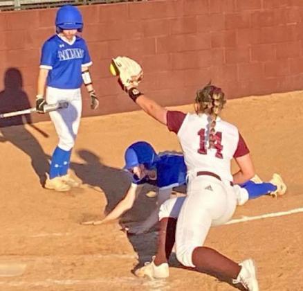 Kali Hunter scores on a passed ball in the Lady Badgers’ 15-4 victory on the road Friday. JAMIE SYX | COURTESY PHOTO
