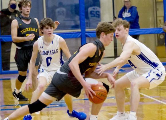 Nate Borchardt (0) and Quinn Pace (4) defend against Thorndale. Borchardt averaged 23 points per game heading into Thursday’s game at Hamilton. JEFF LOWE | DISPATCH RECORD