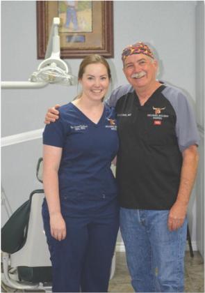 Crystal Eschbach is pictured with her father, fellow dentist Jay Elder. erick mitchell | dispatch record