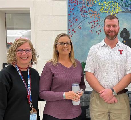 Clay Phillips of Farm Bureau Insurance was on hand to honor October educators of the month at Taylor Creek Elementary School. Each received a Texas Farm Bureau insulated mug and a Mojo’s gift card. Pictured with Phillips are Principal Shona Moore and Jennifer Hughes, Teacher of the Month. courtesy photo