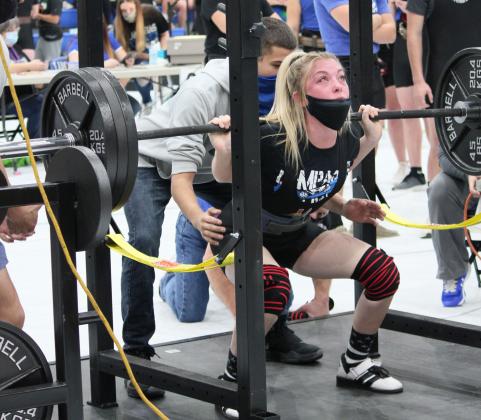 Alyssa Ayers squats 315 pounds on the way to a gold medal in the 123 weight class on Thursday. Photo by Chris Ybarra