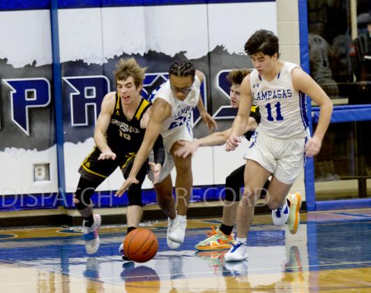 In the Badgers' 89-42 win over Gatesville on Friday, Niko Lewis (23) goes for a steal and Tak Stinnett helps on defense.