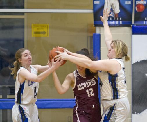 Taylor Allen, left, and Kyliegh Ball guard a Brownwood Lady Lion. 