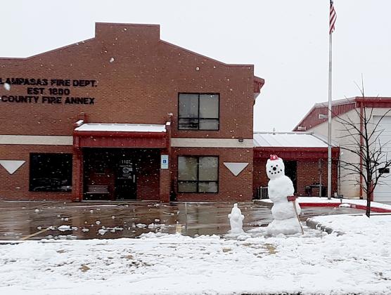 A snowman is shown in front of the Lampasas Fire Department station after firefighters returned from a structure fire on FM 2808 on Sunday. (Photo by Jeff Lowe)