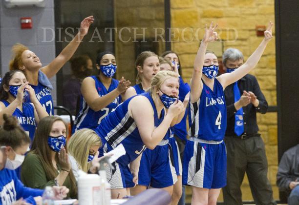 The Lady Badger bench celebrates a big play in the first half. 