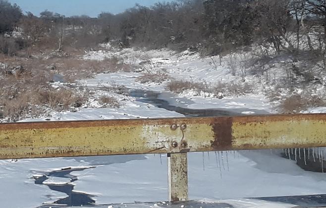 A partially frozen Mesquite Creek is shown along U.S. Hwy 183. 