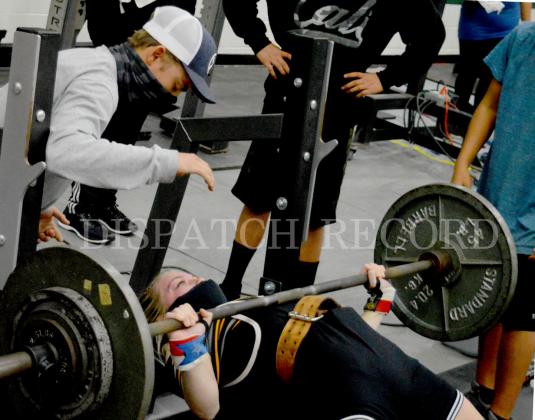 Alyssa Ayers bench presses 200 pounds while her brother, former Badger state qualifier Jason Ayers, spots. 