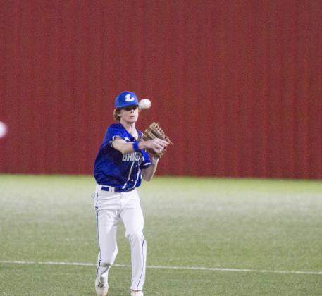 Nate Borchardt makes a throw to first after fielding the ball in Tuesday's district victory. 