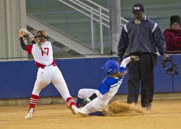 Senior Rose McAnally slides home on a passed ball  in her last district home game. Lampasas won 6-2. 
