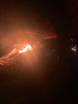 Wayne Hilgenberg sent the Dispatch Record this photo of the vehicle fire that he and neighbor Davis Keele extinguished shortly after a 2019 Ford Mustang crashed into a house at 203 S. Howe St. early Saturday morning.