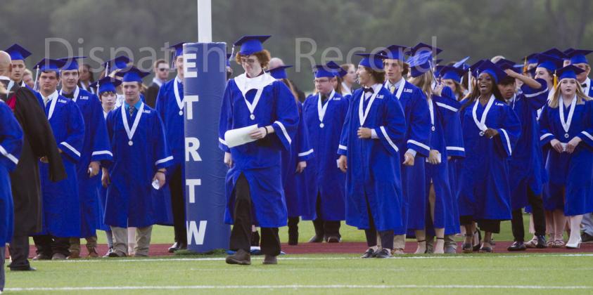 Seniors line up in the end zone at the start of Lampasas High School graduation on Friday at the turf field.