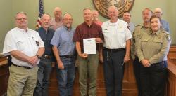 On Monday, the Lampasas County Commissioners Court approved a proclamation recognizing July as “First Responders Month.” Pictured are area first responders, Hill Country 100 Club directors and the Lampasas County Commissioners Court members.