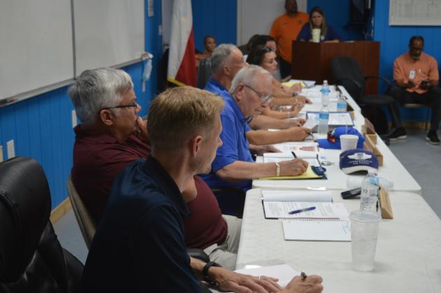 KWSC Board Members listen to questions from citizens during KWSC's board meeting on Wednesday evening. 