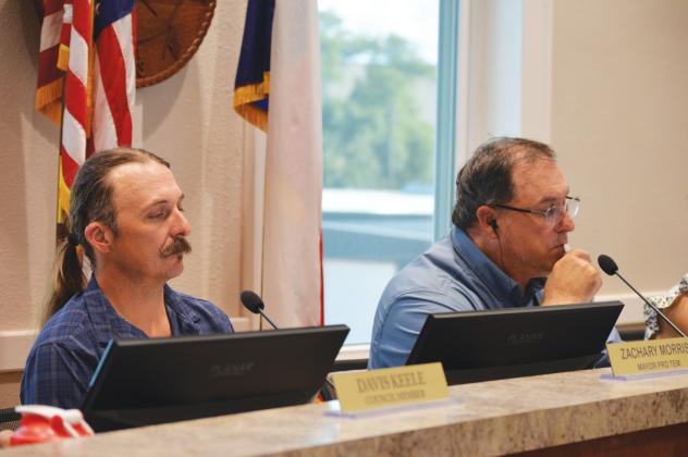 From left, Place 3 Councilman Zachary Morris and Mayor Herb Pearce look on during Monday's regular meeting. ERICK MITCHELL | DISPATCH RECORD 
