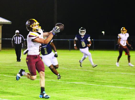 Easton Hamilton looks in a pass from Ulises Caso-Prado during Lometa’s win on Friday. MASON HINES | DISPATCH RECORD