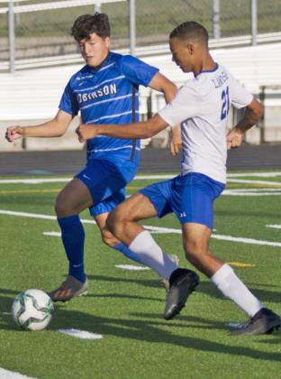 Andrew Grant (21) scores the Badgers’ first goal in the opening minutes of Friday’s bi-district match against Robinson. JEFF LOWE | DISPATCH RECORD